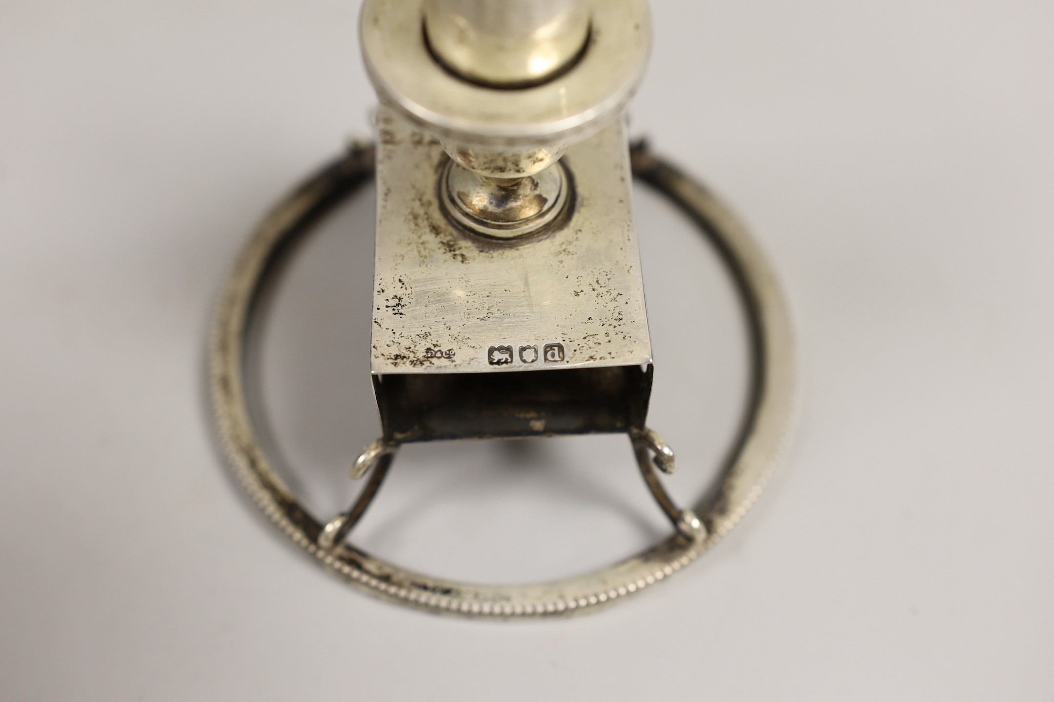 A late Victorian silver combination cigar lighter and matchbox holder, on circular foot, Grey & Co, London, 1899, base diameter 10.2cm.